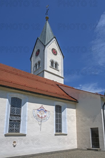 Church of the Assumption of the Virgin Mary with sundial, blue sky, Frauenzel, Allgäu, Bavaria, Germany
