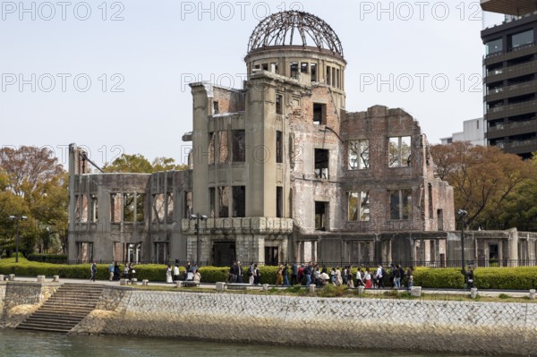 Ruins of the Atomic Bomb Dome, landmark, UNESCO World Heritage Site, peace memorial and memorial to the victims of the atomic bombing of Hiroshima in the Peace Park on the Otagawa River, Naka Ward, Hiroshima, Japan