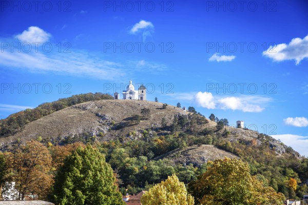 A chapel on a hill with soft autumn colours under a clear blue sky, Mikulov Nikolsburg Czech Republic