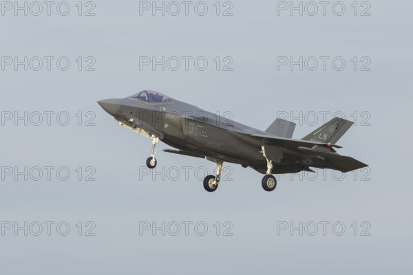 Lockheed Martin F-35 Lightning II fighter military aircraft of the United States air force USAF in flight landing at RAF Lakenheath airbase, Suffolk, England, United Kingdom