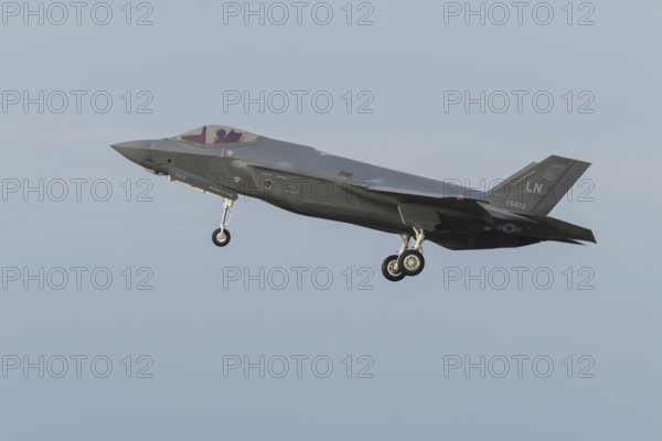 Lockheed Martin F-35 Lightning II fighter military aircraft of the United States air force USAF in flight landing at RAF Lakenheath airbase, Suffolk, England, United Kingdom