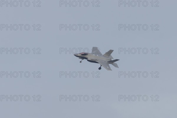 Lockheed Martin F-35 Lightning II fighter military aircraft of the United States air force USAF in flight landing at RAF Lakenheath airbase, Suffolk, England, United Kingdom