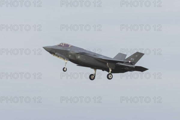 Lockheed Martin F-35 Lightning II fighter military aircraft of the United States air force USAF in flight landing at RAF Lakenheath airbase, Suffolk, England, United Kingdom