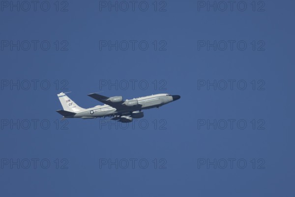 RC-135W Rivet Joint military jet aircraft of the United States Air Force USAF flying, England, United Kingdom