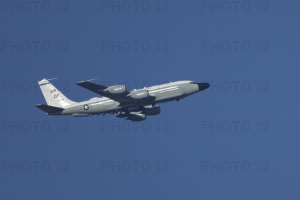 RC-135W Rivet Joint military jet aircraft of the United States Air Force USAF flying, England, United Kingdom