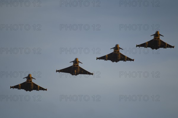 Eurofighter Typhoon four military fighter jet aircraft of the Royal air force RAF flying in formation, England, United Kingdom