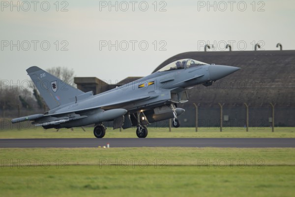 Eurofighter Typhoon military fighter jet aircraft of the Royal air force landing at RAF Coningsby airbase, Lincolnshire, England, United Kingdom