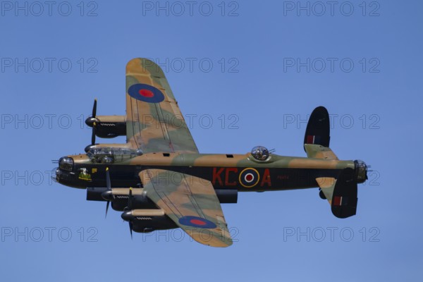 Avro Lancaster warbird military aircraft in Royal air force RAF colours flying, England, United Kingdom