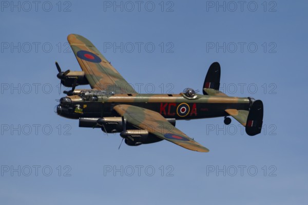 Avro Lancaster warbird military aircraft in Royal air force RAF colours flying, England, United Kingdom