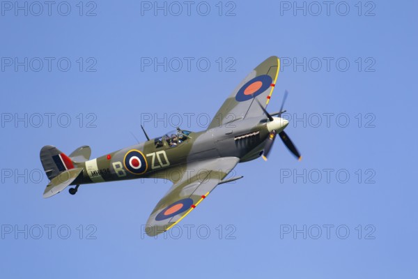 Supermarine Spitfire warbird military aircraft in Royal air force RAF colours flying, England, United Kingdom