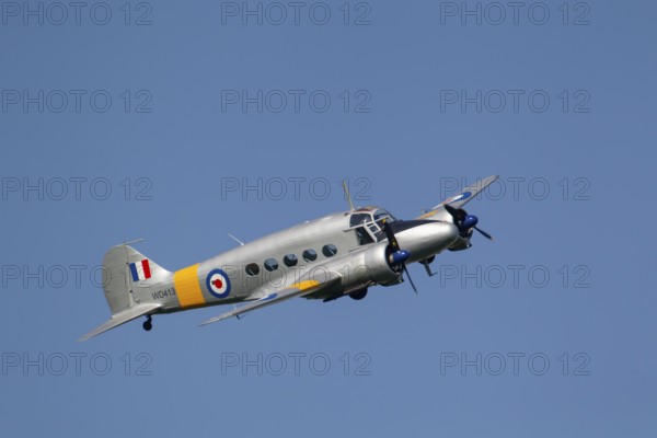Avro Anson warbird military aircraft in Royal air force RAF colours flying, England, United Kingdom