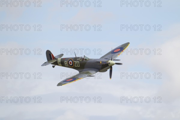 Supermarine Spitfire warbird military aircraft in Royal air force RAF colours flying, England, United Kingdom