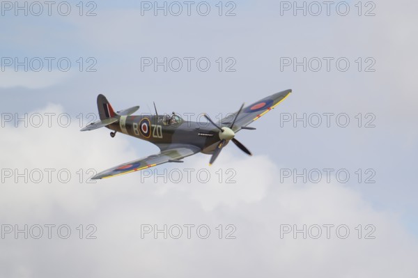 Supermarine Spitfire warbird military aircraft in Royal air force RAF colours flying, England, United Kingdom
