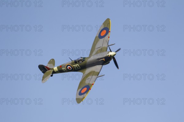 Supermarine Spitfire warbird military aircraft in Royal air force RAF colours flying, England, United Kingdom
