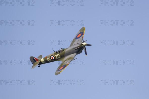 Supermarine Spitfire warbird military aircraft in Royal air force RAF colours flying, England, United Kingdom