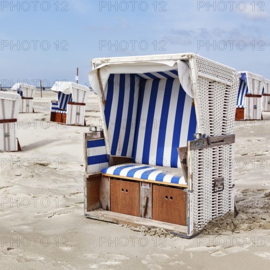 Empty white beach chairs, Sankt Peter-Ording, Eiderstedt peninsula, Wadden Sea National Park, North Frisia, Schleswig-Holstein, Germany