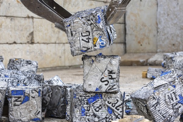 Cubes made from scrap metal, disused car licence plates. Symbolic photo. Stuttgart, Baden-Württemberg, Germany