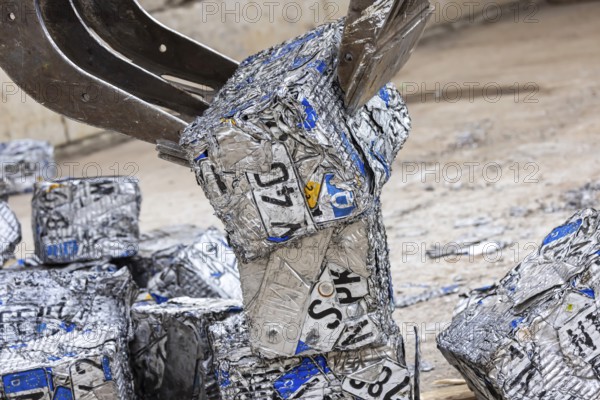 Cubes made from scrap metal, disused car licence plates. Symbolic photo. Stuttgart, Baden-Württemberg, Germany