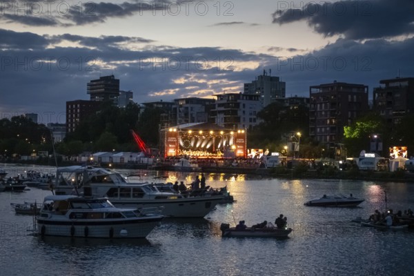 Under the direction of chief conductor Alain Altinoglu, the Hessian Radio Symphony Orchestra (hr) performs the Europa Open Air Concert on the banks of the River Main, near the Weseler Werft shipyard, in front of more than 10, 000 people, Weseler Wertf, Frankfurt am Main, Hesse, Germany
