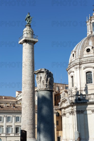 Left 40 metre high Trajan's Column Victory Column Column of honour for Roman Emperor Trajan, at the top statue of Saint Peter the Apostle and small platform with railing, Trajan's Forum, Rome, Lazio, Italy