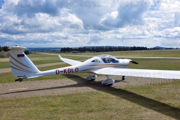 Motorised glider taxiing to the runway at Wasserkuppe airfield, Rhön, Gersfeld, Fulda district, Hesse, Germany