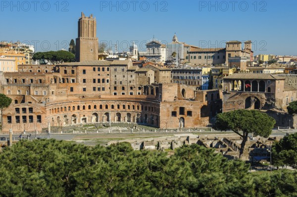 View from an elevated position on Trajan's Forum and Trajan's Markets Forum of Roman Emperor Trajan part of imperial forums, in front modern street Via Alessandrina divides historical ancient Trajan's Forum, Rome, Lazio, Italy