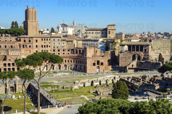 View from elevated position on Roman hill Quirinal Quirinal Hill with in front Forum of Roman Emperor Trajan with in the back left Trajan's Markets Markets of Trajan Mercati di Traiano and Museum of the Imperial Forums, Museum of the Imperial Forums, Museo dei Fori Imperiali, in the centre of the picture modern street Via Alessandrina shares historical ancient Trajan's Forum, Rome, Latium, Italy