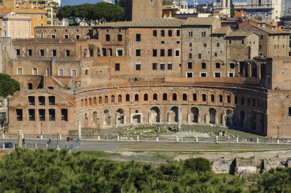 View from elevated viewpoint on Trajan's markets in part of Trajan's Forum Forum of Roman Emperor Trajan part of imperial forums, in front modern street Via Alessandrina divides historical ancient Trajan's Forum, Rome, Lazio, Italy
