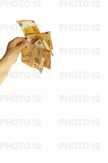 Hand holding euro banknotes against a white background, symbolizing wealth, savings, or expenses