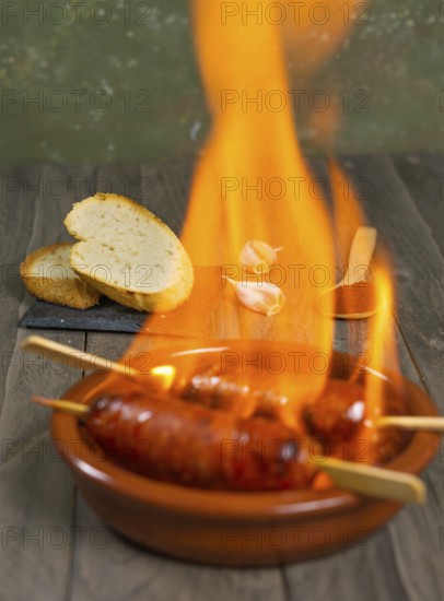 Spicy chorizo to hell cooked over a fire right on the table