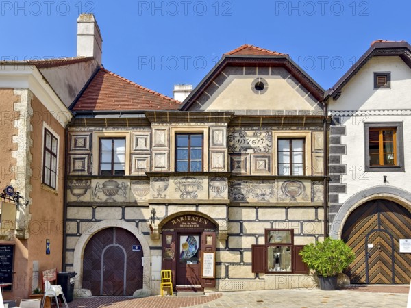 Renaissance building with frescoes and detailed stone decorations on a quiet street Mödling Lower Austria Austria