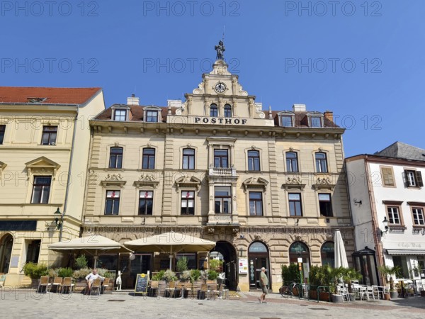 Historic building with baroque façade and decorative windows on a sunny town square Mödling Lower Austria Austria