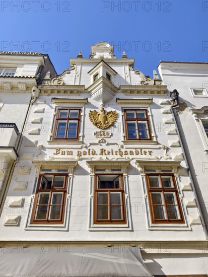 Historic building façade with golden eagle decoration under a blue sky Bürgerhaus Zum goldenen Reichsadler Old Town Krems Wachau Waldviertel Lower Austria Austria