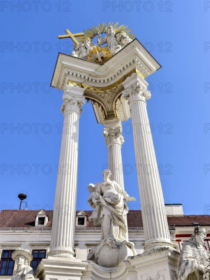 Magnificent monument with columns and statues under a bright blue sky Trinity Column Old Town Krems Wachau Waldviertel Lower Austria Austria