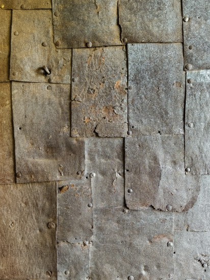 Textured rusty metal panels with rivets forming an industrial surface Riegersburgs Styria Austria