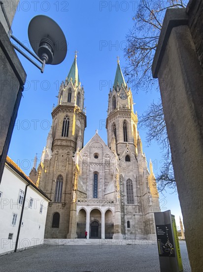 High Gothic church towers rise symmetrically into the clear blue sky, Klosterneuburg Lower Austria Austria