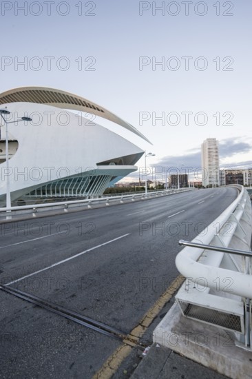 Futuristic building next to an empty street in an urban environment at dusk Opera