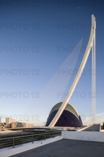 Large modern bridge next to futuristic blue building