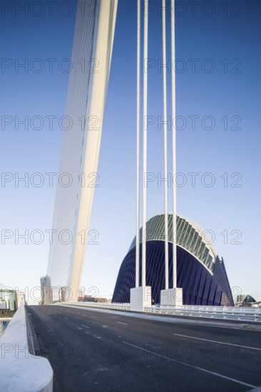 Modern bridge with view of futuristic blue building