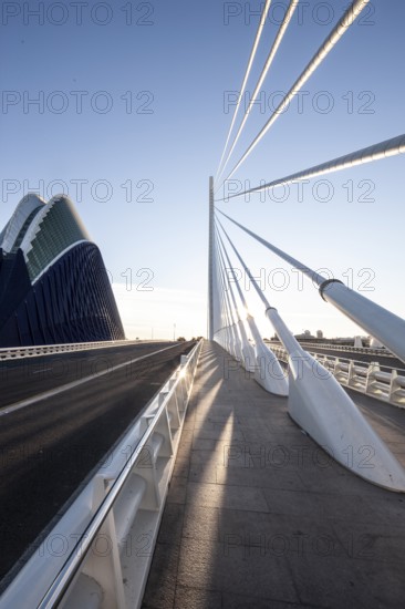 Futuristic bridge in Valencia with slender lines and shadows in the sunlight