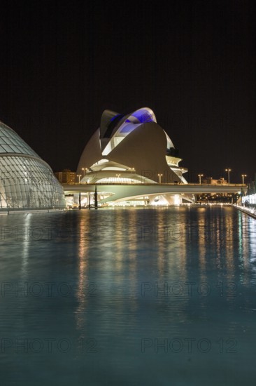 Valencia Spain Modern building reflected in the calm water at dusk Opera City of Arts and Sciences