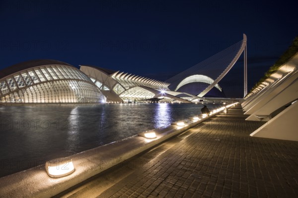 Valencia Spain Illuminated path along a futuristic bridge and buildings at night City of Arts and Sciences