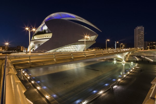 Valencia Spain Bright futuristic building and bridge illuminated at night in urban surroundings Opera