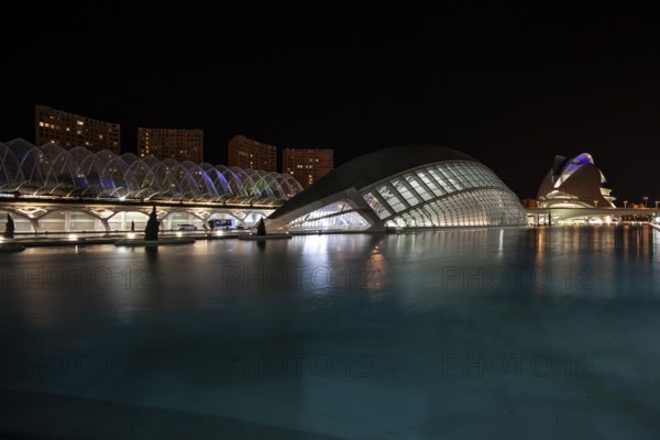 Valencia Spain Night view of the city with modern buildings and water in the foreground City of Arts and Sciences
