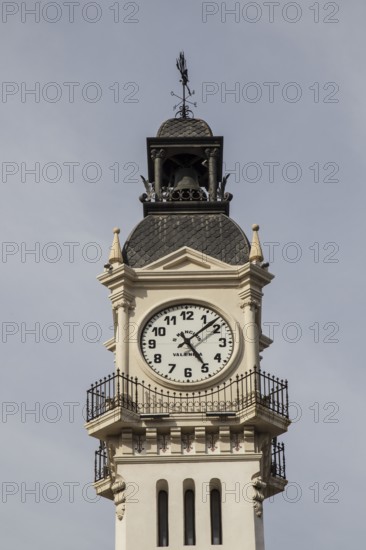 A historic clock tower with detailed architecture against a clear sky