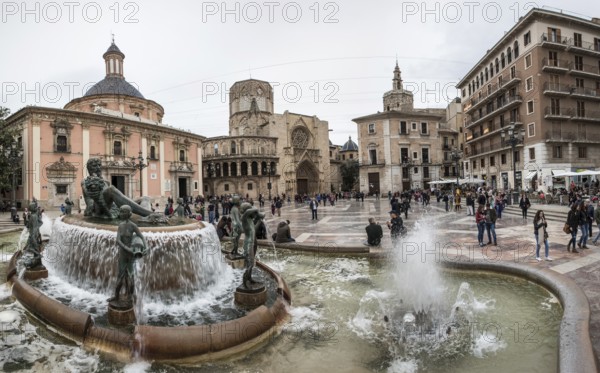 Historic fountain in front of the Virgen de los Desamparados Naval Museum Fuente del Turia fountain in Plaça De La Mare de Déu
