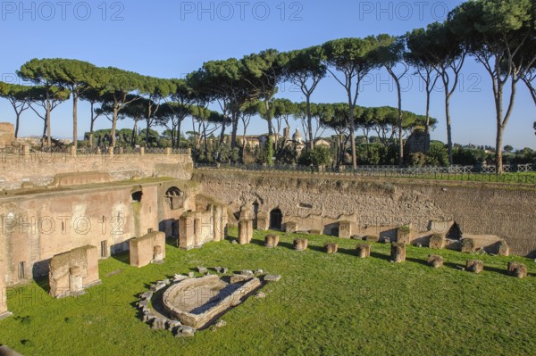View of part of ancient historical Palatine Stadium Hippodrome on Palatine Hill of Emperor Domitian with crescent-shaped small fountain on the left, Palatine Hill, Rome, Lazio, Italy