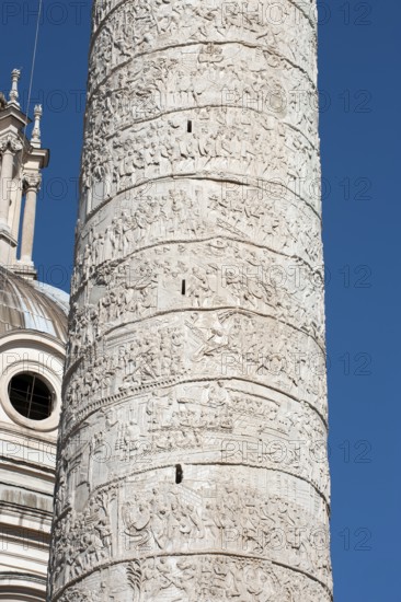 Detail of spiral marble relief on column of honour Victory Column from year 113 with scenes from wars against the Dacians made of Carrara marble from Lunensian marble for Roman Emperor Trajan from antiquity in Trajan's Forum in ancient Rome, Rome, Lazio, Italy