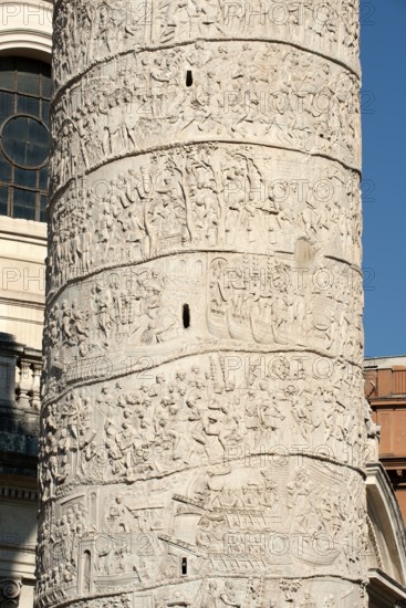 Detail of spiral marble relief on column of honour Victory Column from year 113 with scenes from wars against the Dacians made of Carrara marble from Lunensian marble for Roman Emperor Trajan from antiquity in Trajan's Forum in ancient Rome, Rome, Lazio, Italy
