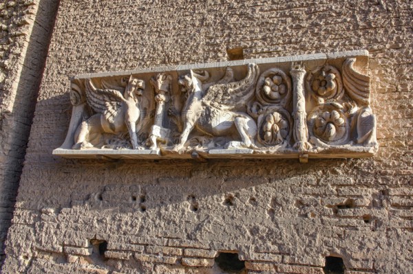 Half relief with mythical figures winged creatures griffins on brick wall of ancient building on Roman Palatine Hill Palatine, Rome, Lazio, Italy